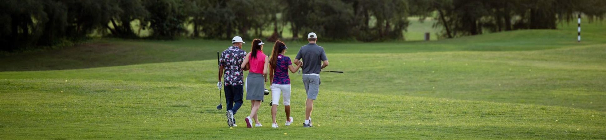 golfers walking on course