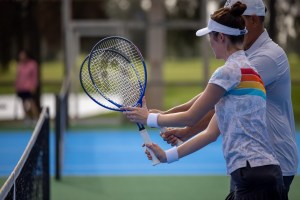 players holding tennis racquets